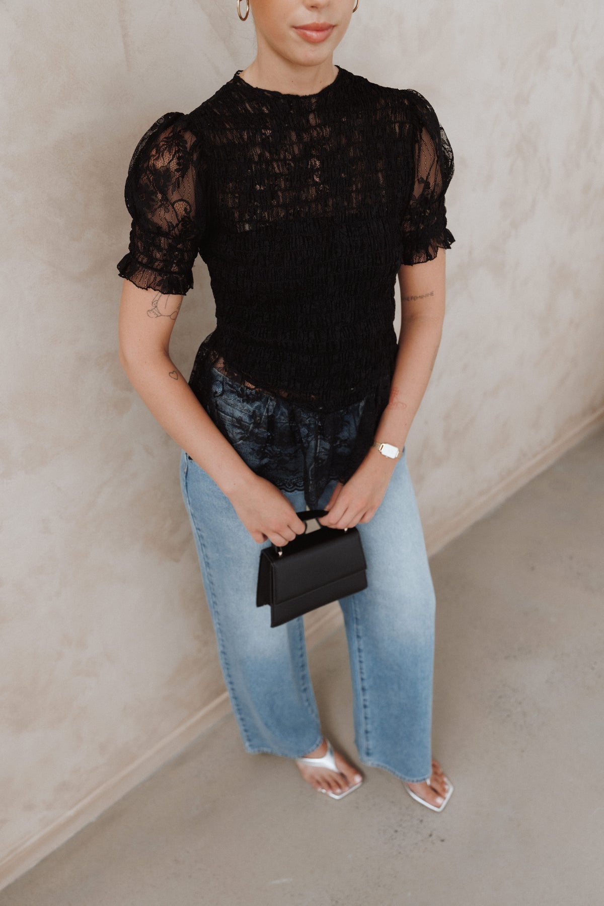 Adeline Peplum Top in Black – view 1 of 7