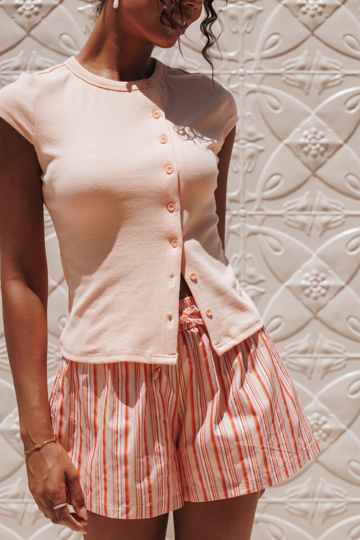 Tatum Asymmetrical Knit Top in Coral – view 1 of 8