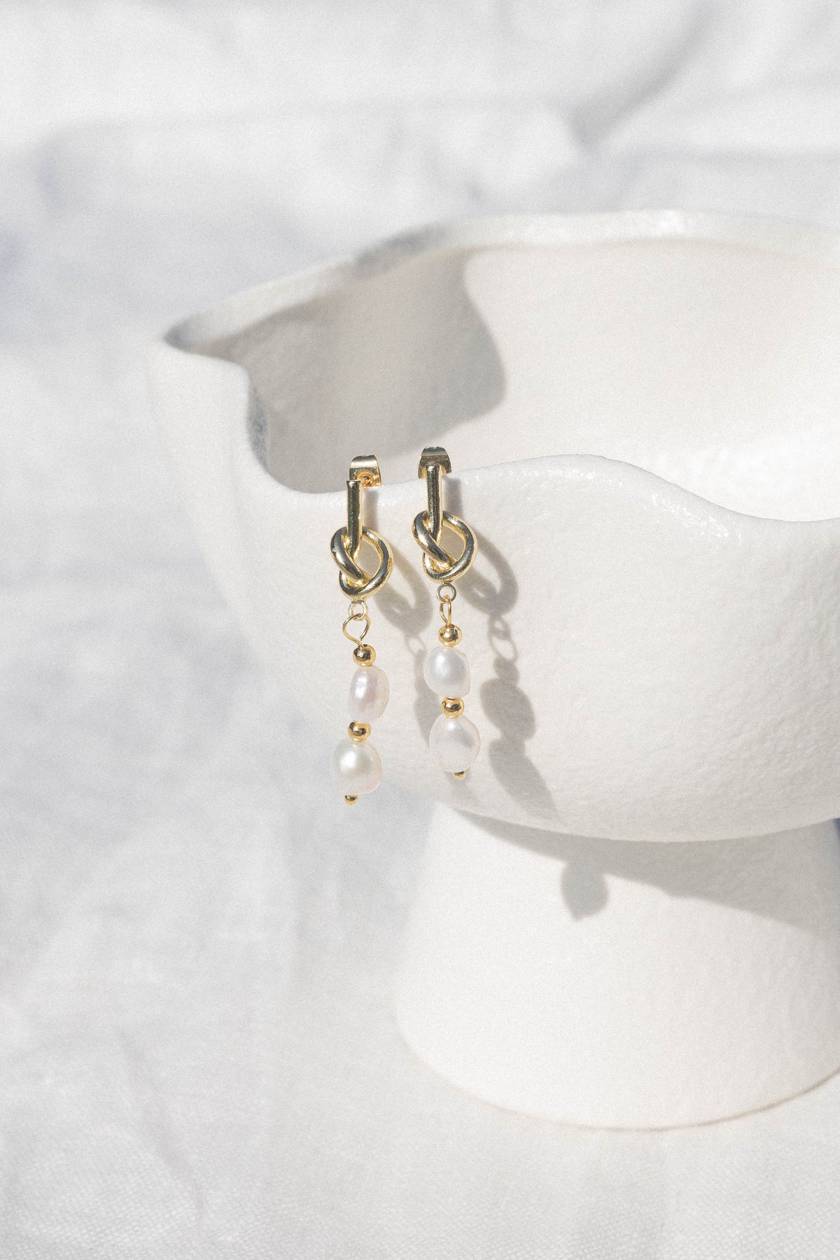 Trixton Pearl Drop Earrings in Gold – view 1 of 2