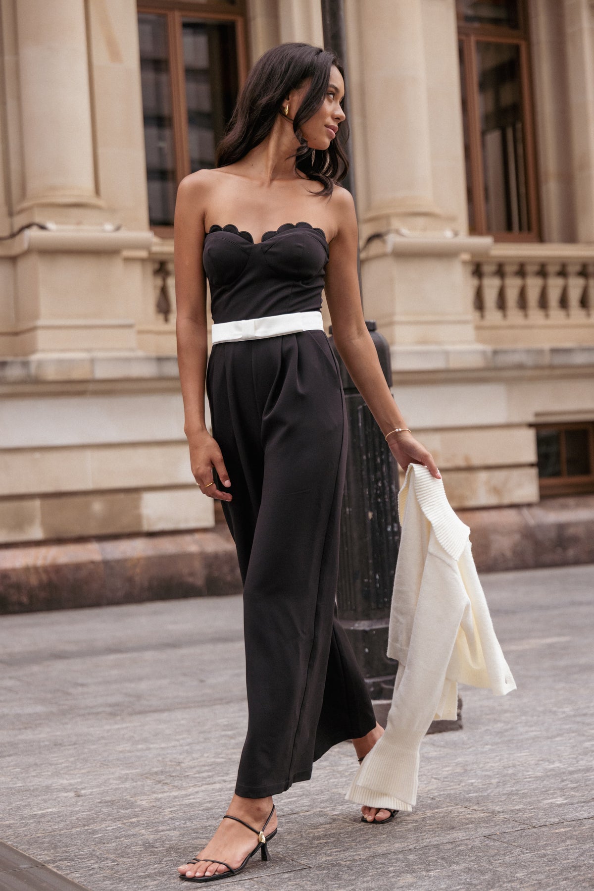 Elaria Scalloped Belted Jumpsuit in Black – view 1 of 8